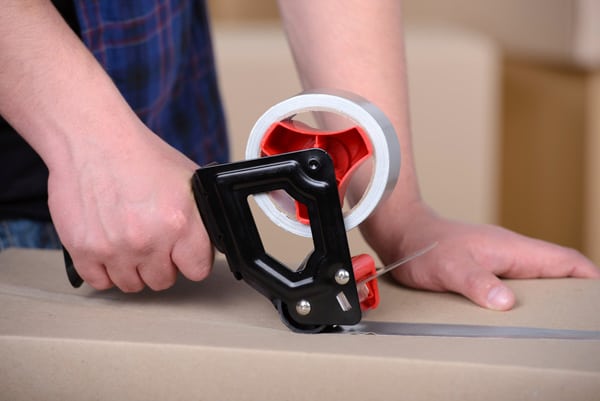 Securing a cardboard box with tape